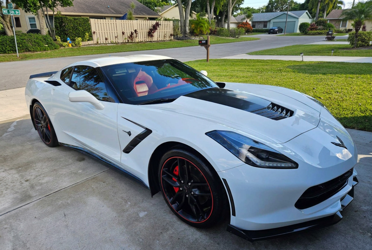 White Corvette before and after a full detail in a Boca Raton driveway - after